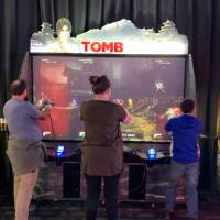 Three alumni playing Tomb